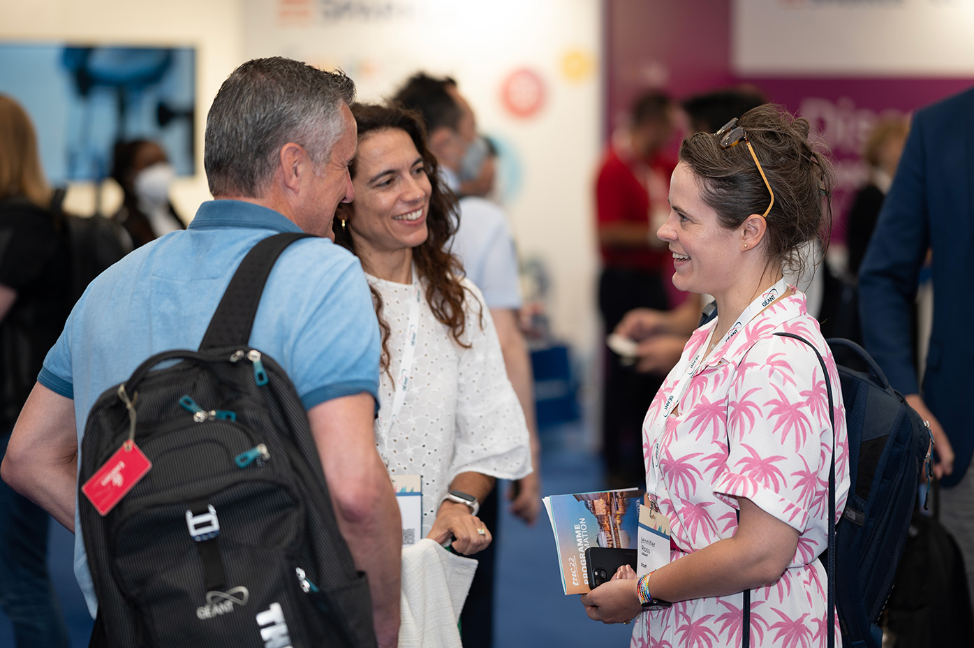 Photo of TNC22 attendees talking during a break.